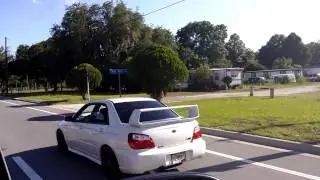 Subaru sti with a straight pipe