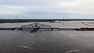 BNSF train crossing the Grassy Point Swing Bridge