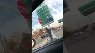 Man Changing Gas Station Prices With Stick