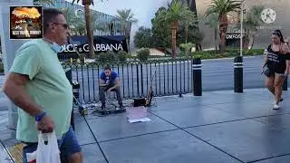 WATCH THIS Amazing guitarist busking on Las Vegas Strip.