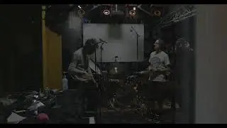 Setting up drum microphones in the recording studio