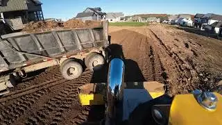 John Deere 650p grading topsoil