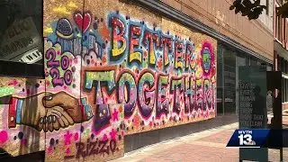 Artists spruce up downtown Birmingham storefronts damaged during riots