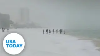Florida, Alabama beaches covered in snow as winter storm hits South | USA TODAY