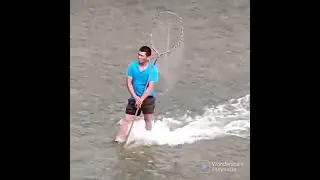 he is riding a crocodile