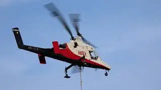 Rotex Helicopter  Kaman K-1200 K-Max HB-ZTW hovering over FC Unterf&ouml;hrung football pitch