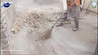 The sanitation staff of WSSC Swat are cleaning the roads on the Angro Dherai Bypass.