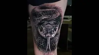 Black Ink Snake Tattoo On Girl Left Thigh