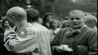 French female Nazi collaborators with shaved heads marched on the streets in subu   HD Stock Footage