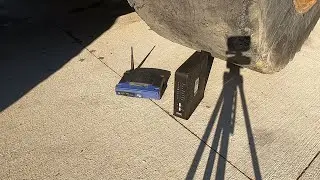 Crushing a modem and router (1x and 1/8th speed slow motion)