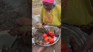 Bushmen roasting wild birds using ancient techniques passed down for generations.
