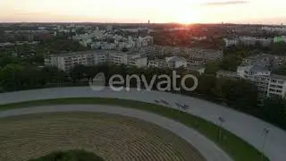 Harness Racers on Dirt Horse Race Track in Berlin, Germany at Sunset, Aerial Follow Tracking Sho...