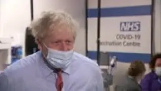 UK PM reacts after first COVID vaccinations