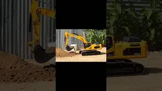 Teamwork of RC Construction Vehicles Making a Perfect New Road