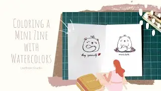 Coloring a mini zine with watercolors