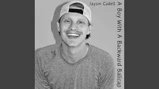 A Boy With A Backward Ballcap