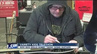 Win a guitar signed by Robby Takac