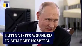 Russian President Vladimir Putin visits wounded in military hospital on country&rsquo;s national day