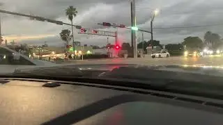 Northbound Brightline train flying past the crossing.