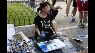 Rome Collesium, street artist paints with spray
