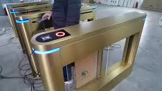 Golden automatic ticket barrier gate NFC reading for theme park ticketing system.