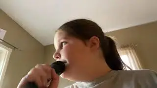 I am sitting here in my room singing