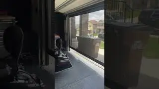 Another motorized garage screen for a garage gym by AVA Custom Screens & Solutions!