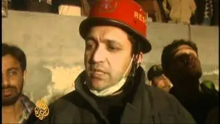 Scores trapped in Pakistan building collapse