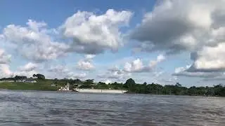 Peaceful Boat Ride on the Amazon: Lush Jungle & Moody Skies
