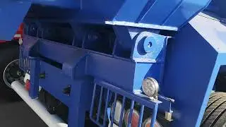 Under the Microscope: The Engineering Details of a Blue 3-Axle Dump Semi-Trailer.