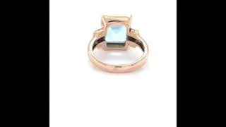 9ct Rose Gold Emerald Cut Blue Topaz Ring.