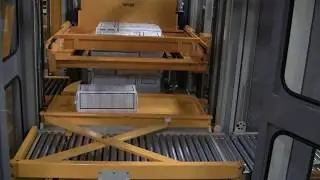 Palletizer showing bundles row build with a TopTier palletizer