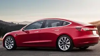 Tesla plagued by production delays, crash probe, recalls