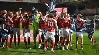Players and fans celebrate Cheltenham's promotion to League One