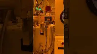 A robotic transfer of a shadow mask from the loadlock to the mask library chamber.