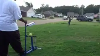 tra hitting off the pitching machine