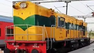 FRESH YELLOW SHUNTER ENGINE ENTERS HALT STATION WDS6AD 36300