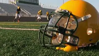 VideoVault Stock Video: American football team is warming up on the field