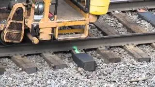Rail anchors (anti-creepers) being tightened