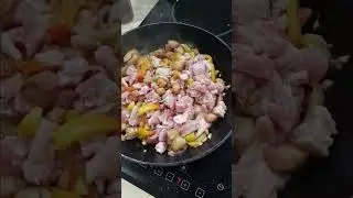 Pork cooked in fish sauce, tomato, onion and garlic.