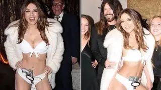 Elizabeth Hurley channels&nbsp;Bond girl Ursula Andress at 007 NYE bash with boyfriend Billy Ray Cyrus
