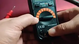 Tacklife DM02A multimeter checking batteries voltage on my AA and C batteries