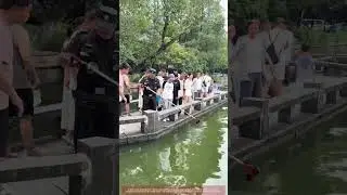 West Lake: Staff Retrieve Phone with Extended Pole