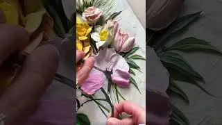 Palette knife sweeps yellow paint, thick petals bloom across canvas.