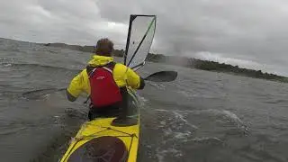 High wind kayak sailing.