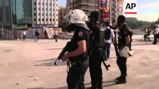 Riot police push past barricades; tear gas, petrol bombs
