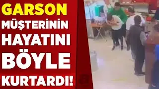 Soluk borusuna ekmek kaçan müşterisini 'Heimlich manevrası' ile kurtardı | A Haber