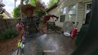 Practicing with my bow fishing rig.