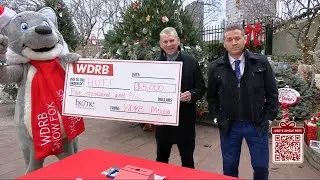 WDRB General Manager Bill Lamb presents $5,000 check for Jude's Jingle Tree