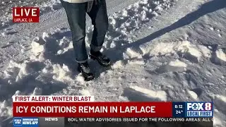 Ankle-deep snow and ice remains on raised portion of I-55/I-10 interchange